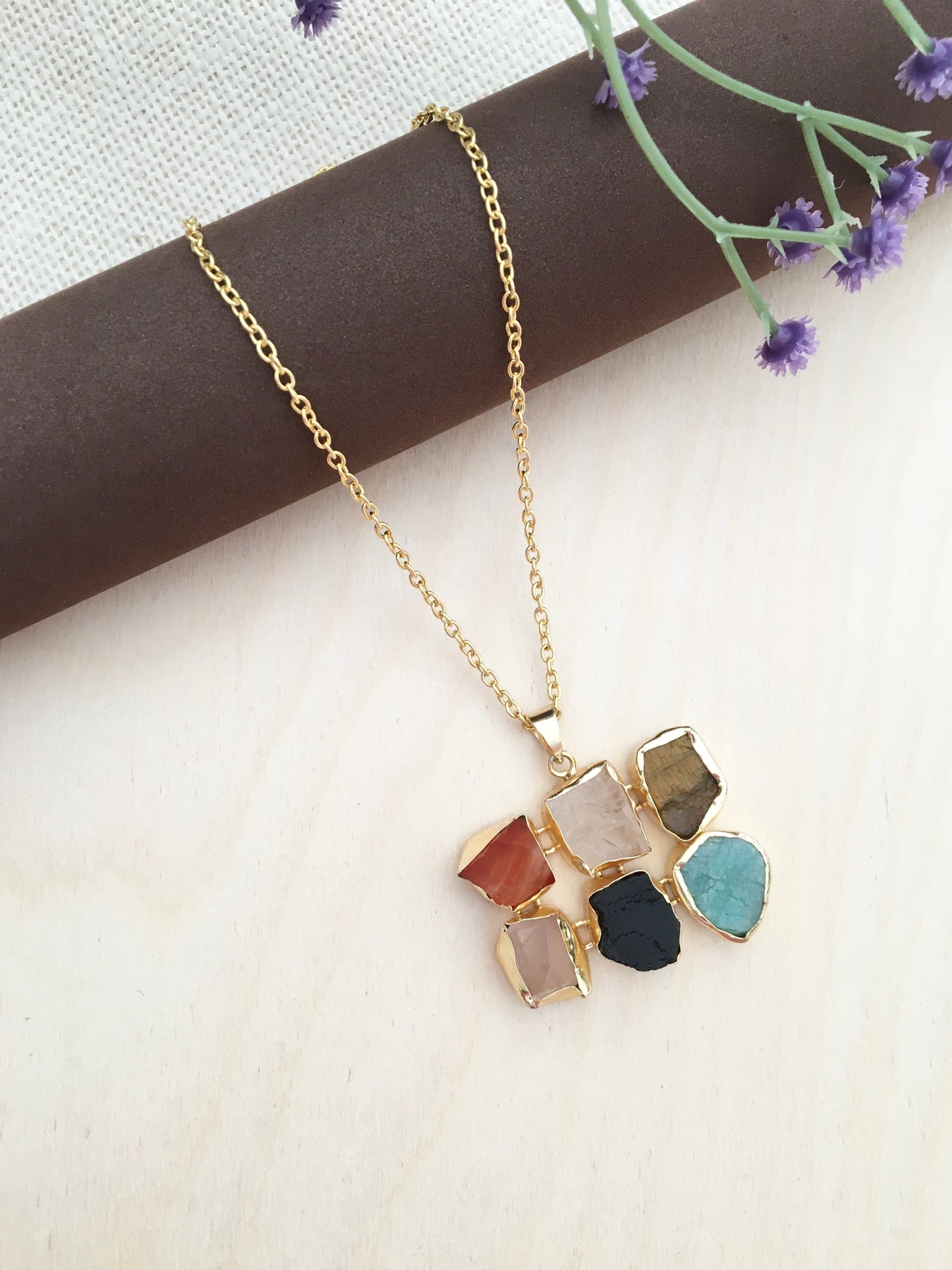 Half-round stone pendant set